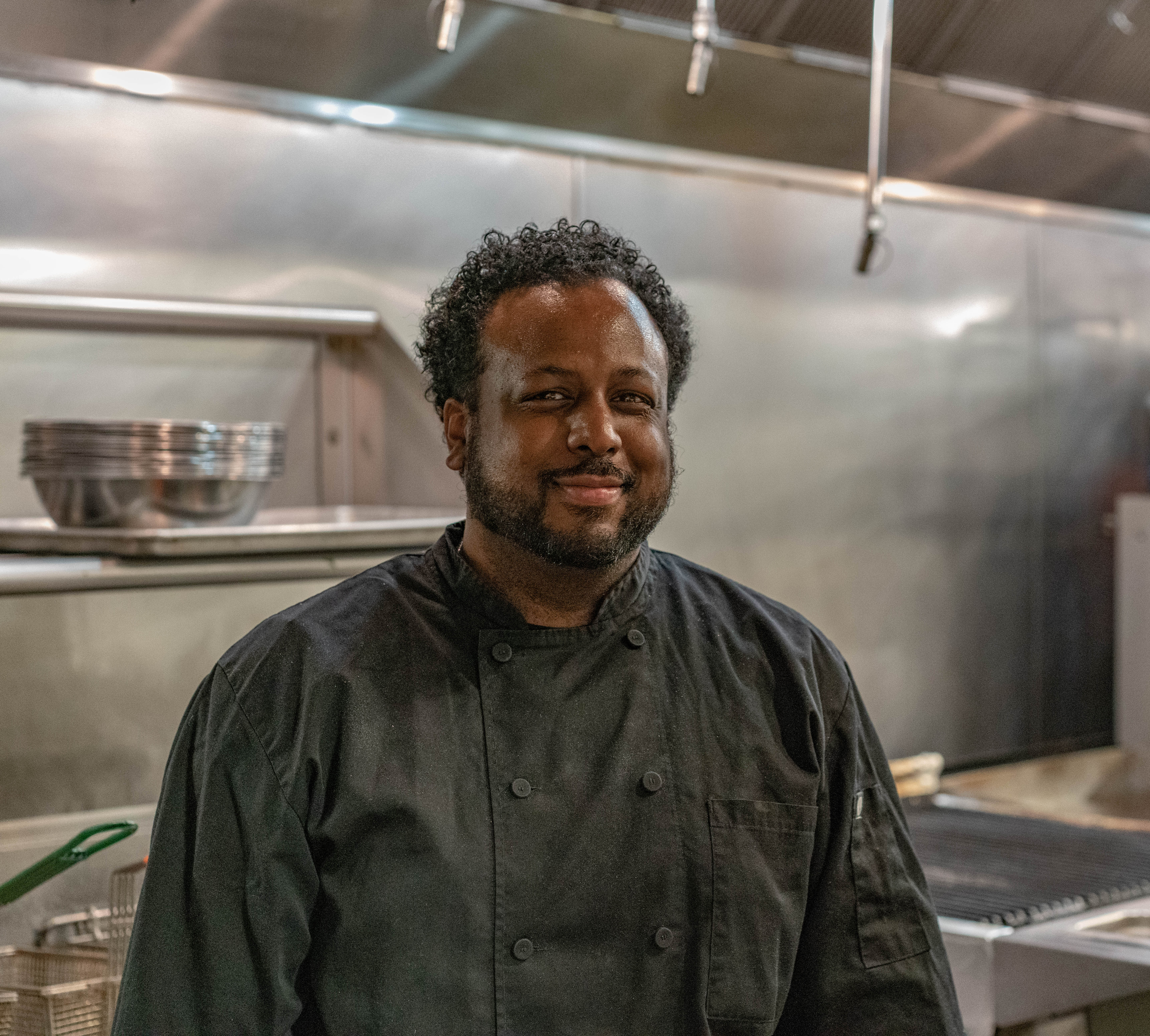 a man standing in a kitchen