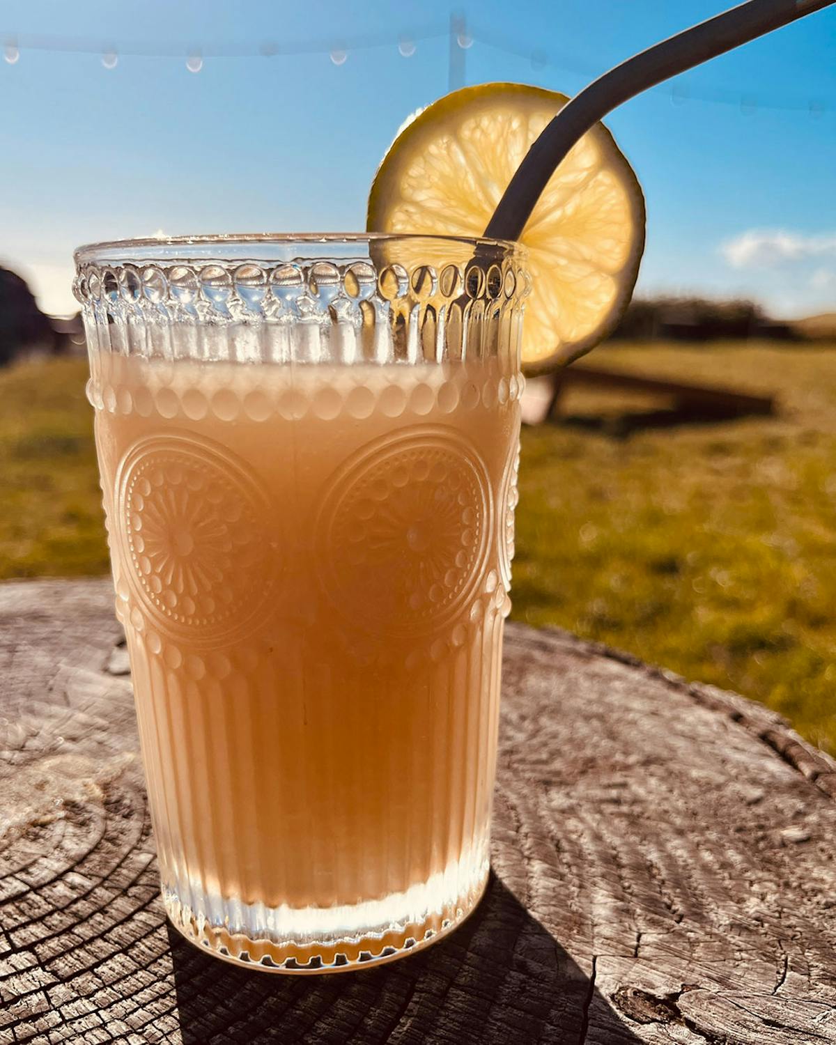 a close up of a glass of orange juice