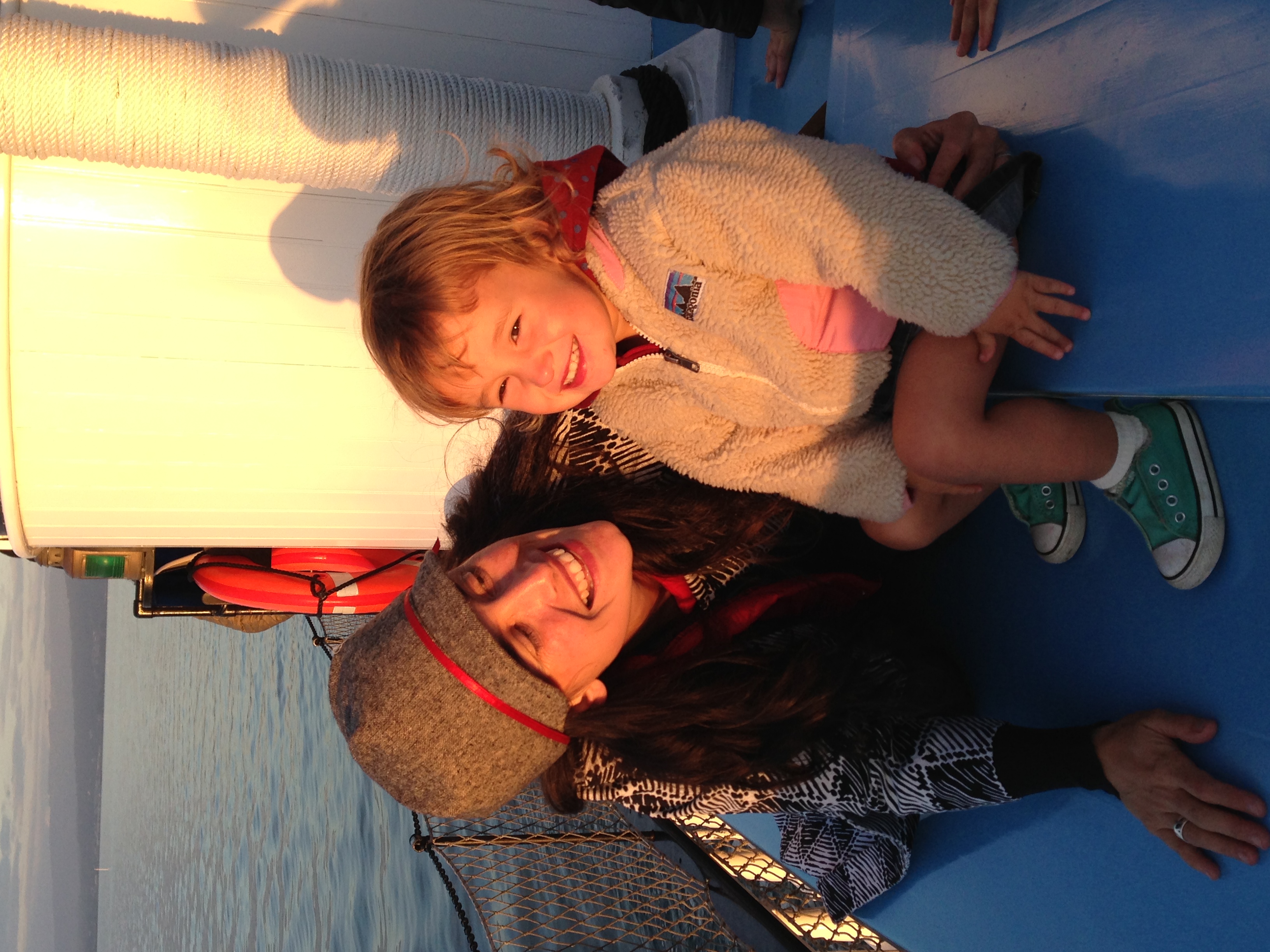 a woman sitting on a boat in the water