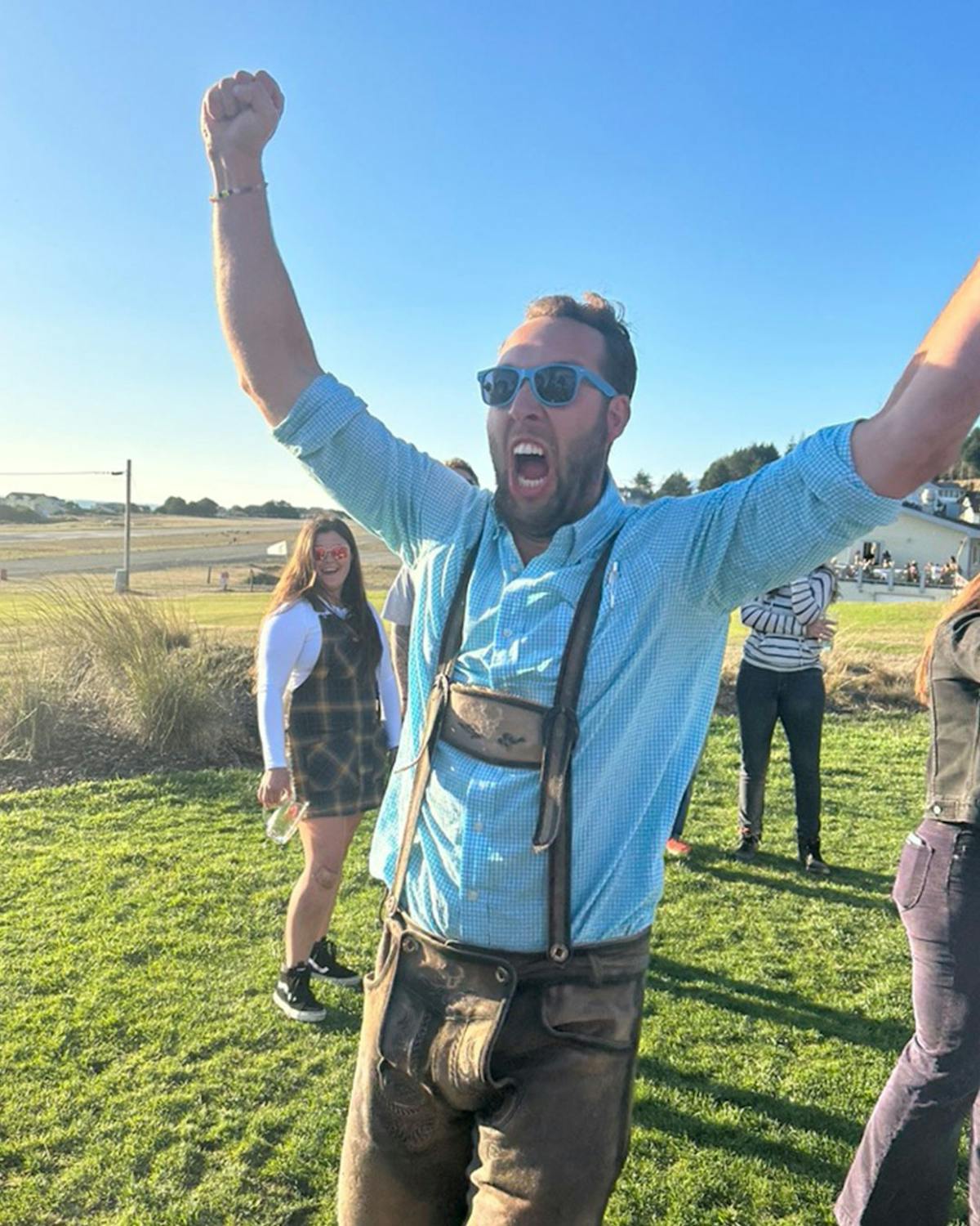 a person standing on top of a grass covered field