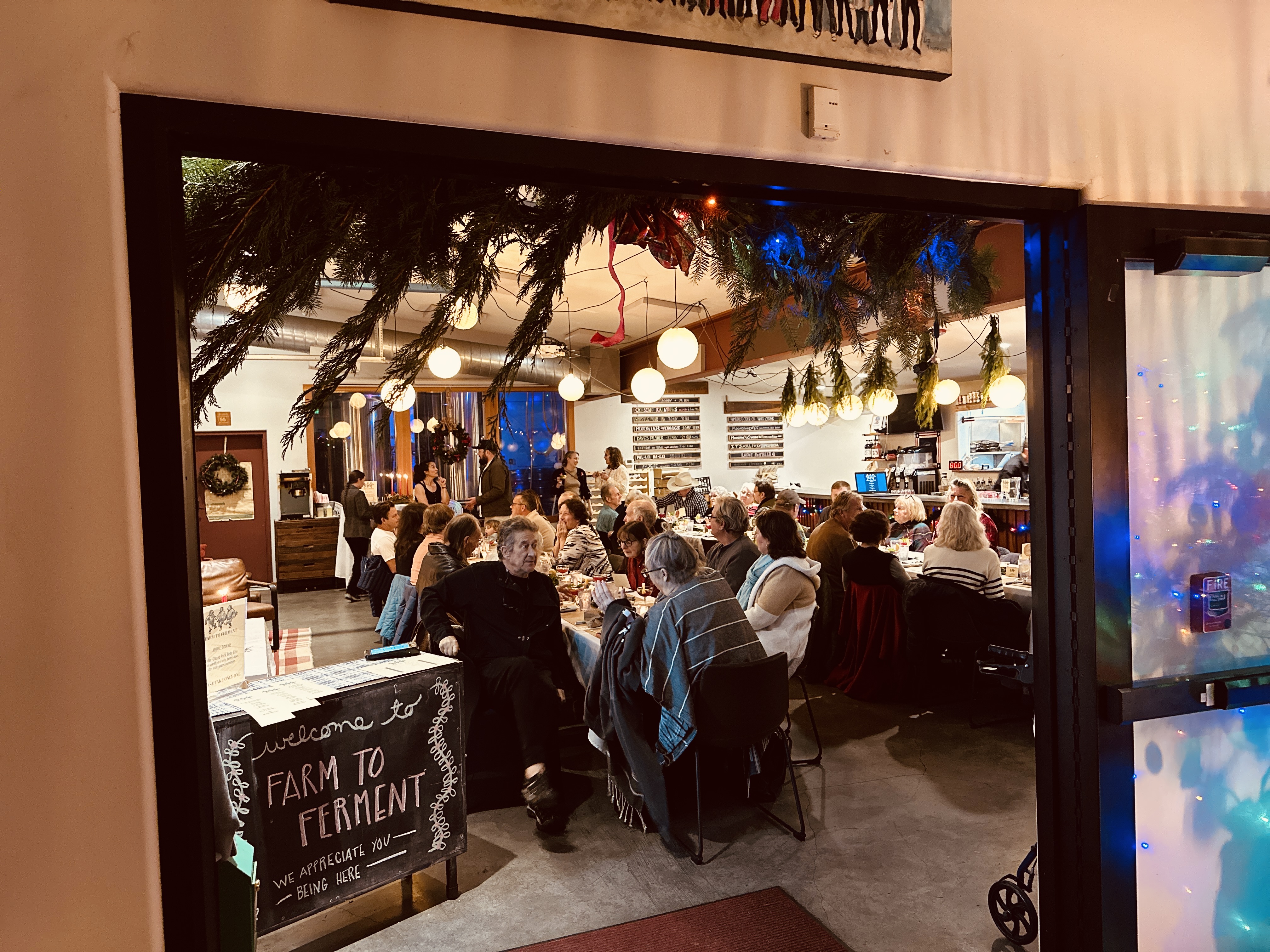 a group of people standing in front of a store