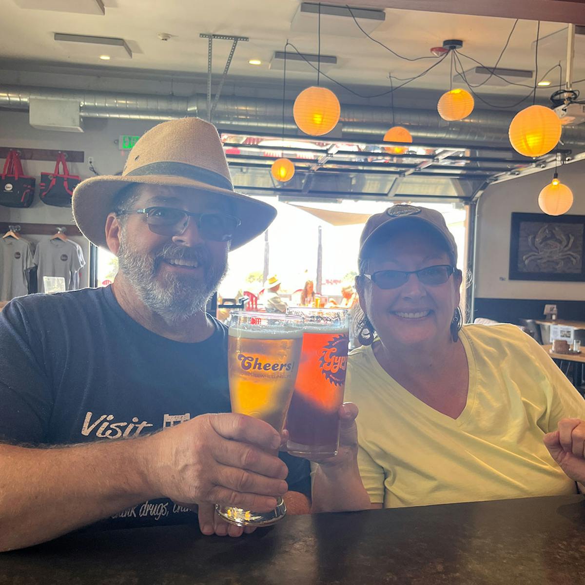 a man holding a glass of beer