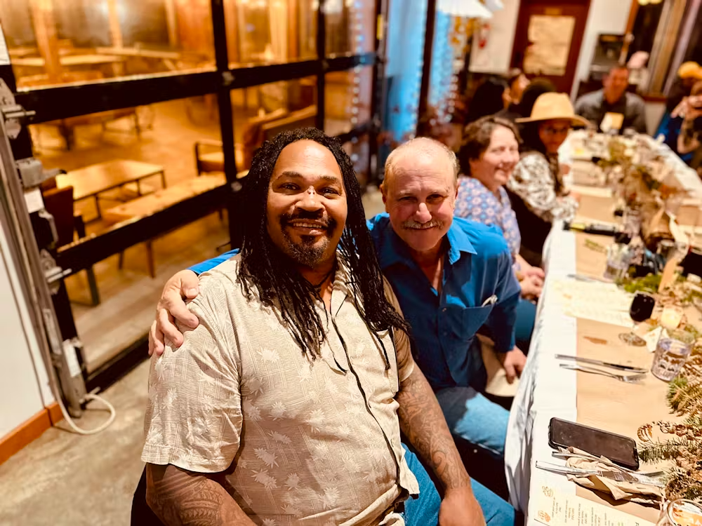 a group of people sitting at a table