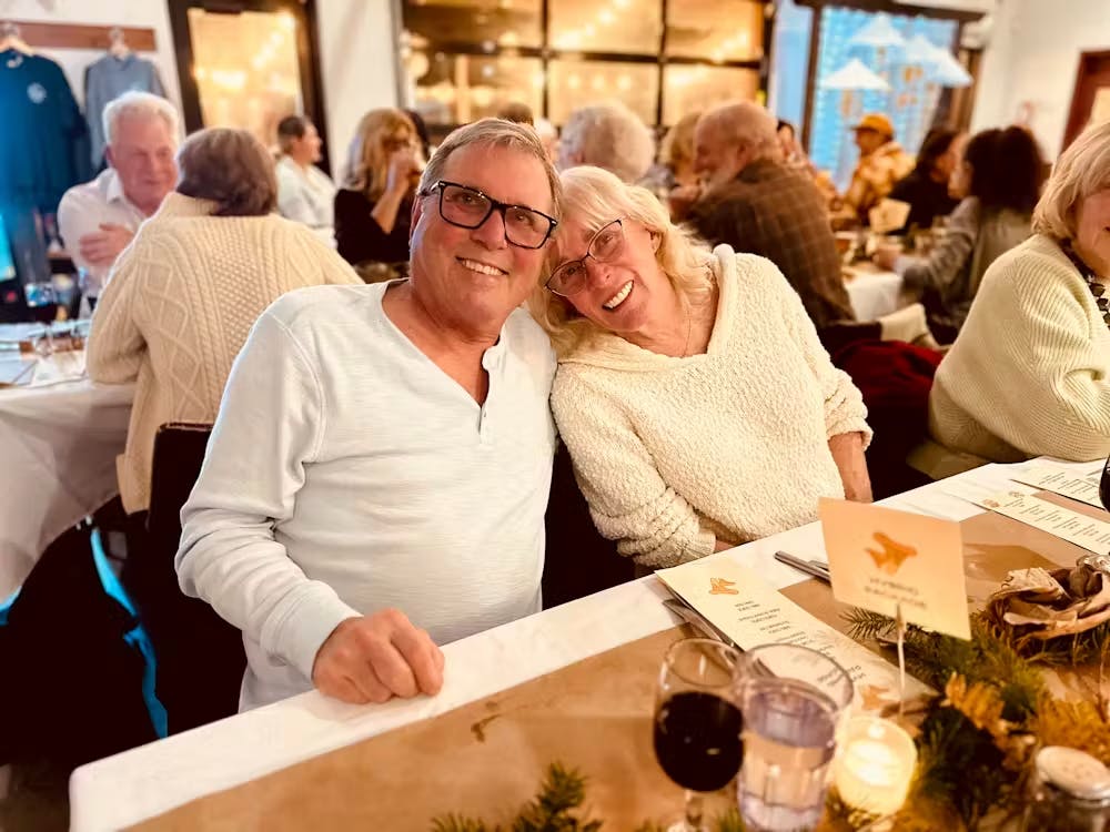 a group of people sitting at a table