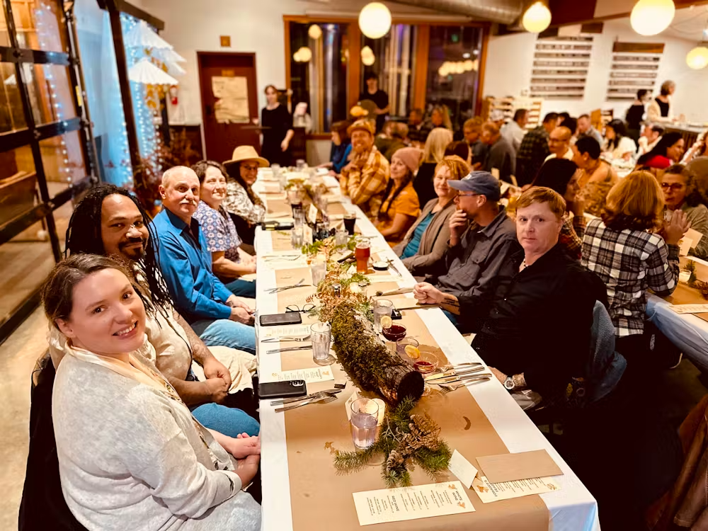 a group of people sitting at a table