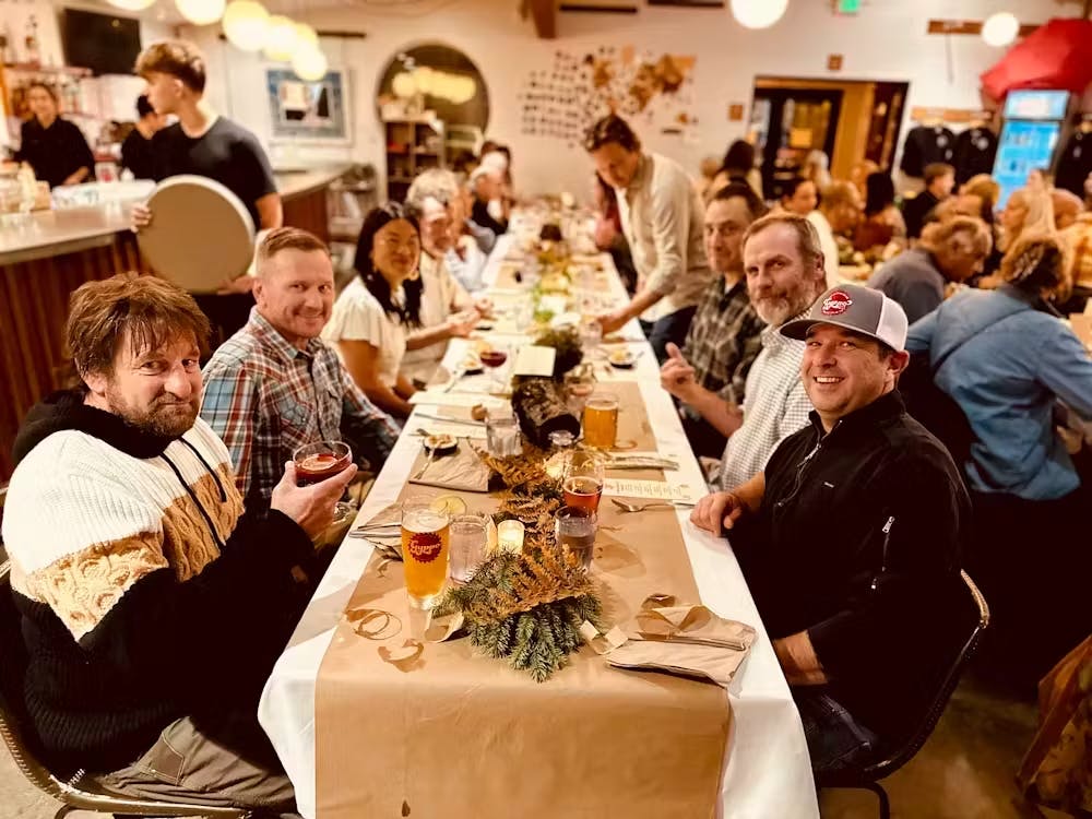 a group of people sitting at a table