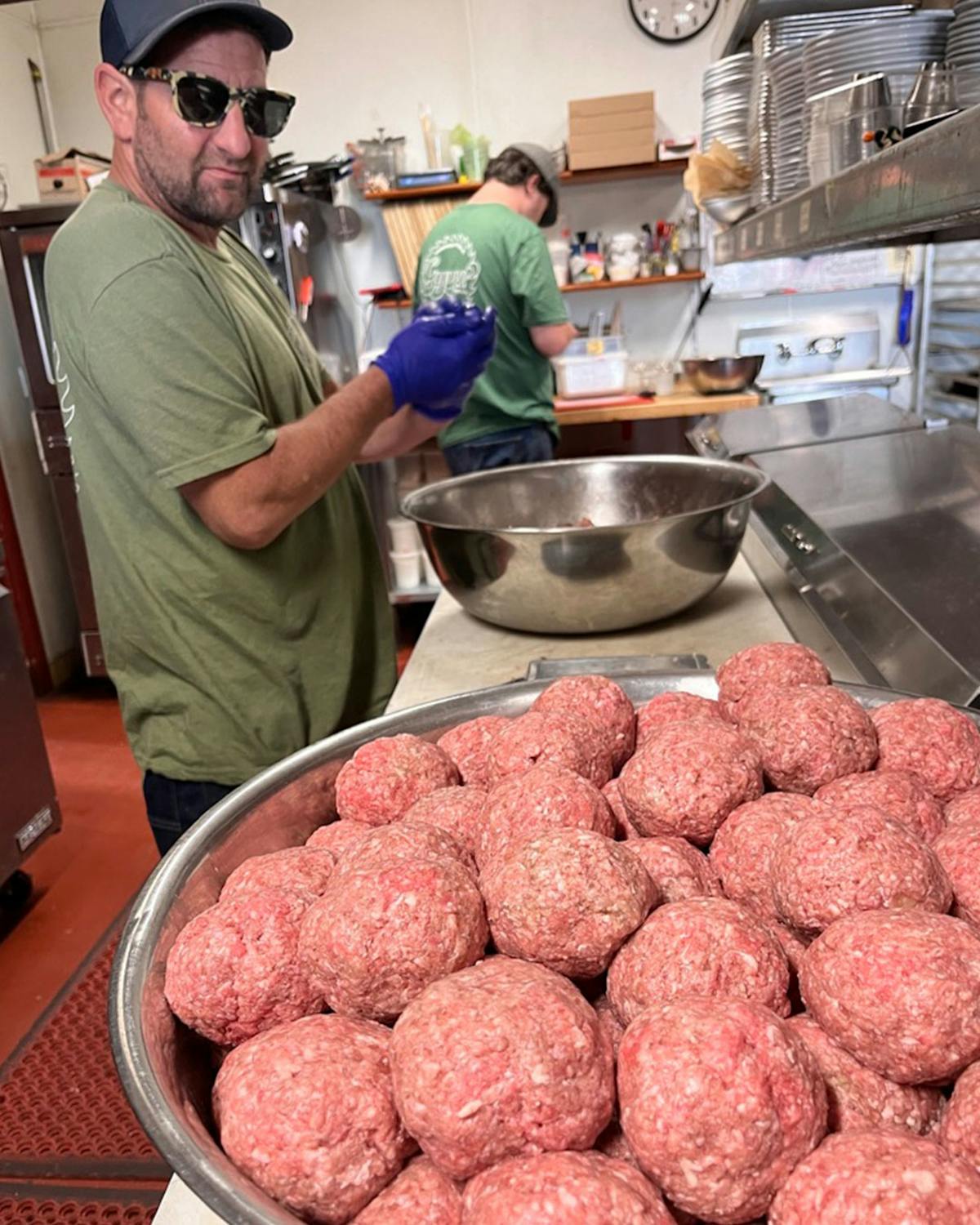 a person cooking in a kitchen preparing food