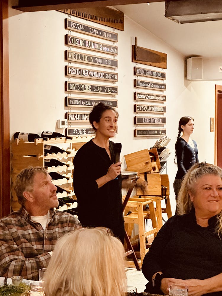 a group of people sitting at a table
