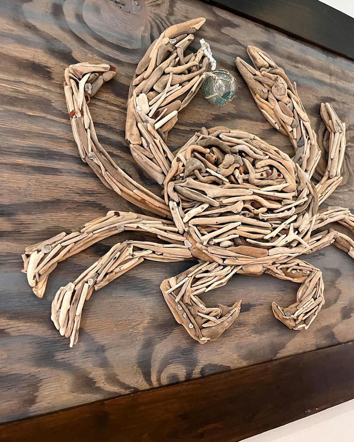 a chain sitting on top of a wooden cutting board