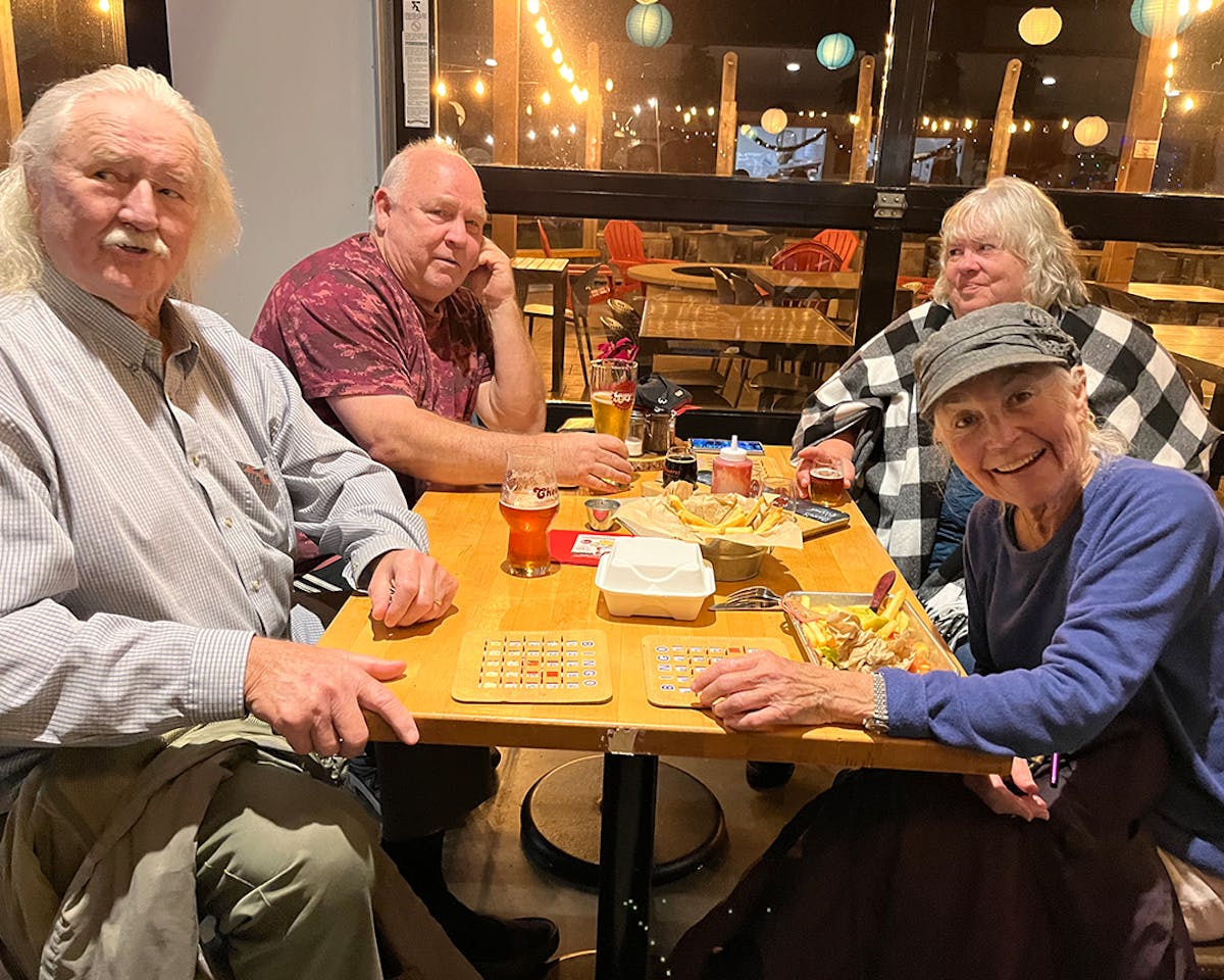 a group of people sitting at a table