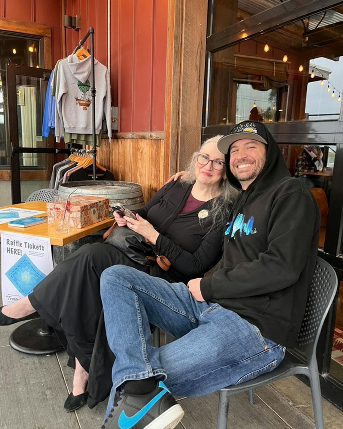 a man and a woman sitting on a table