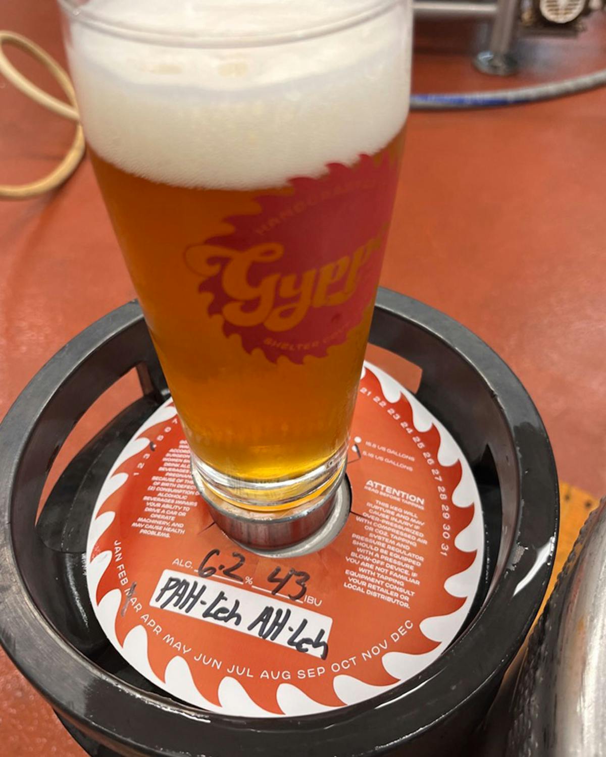 a cup of coffee and a glass of beer on a table
