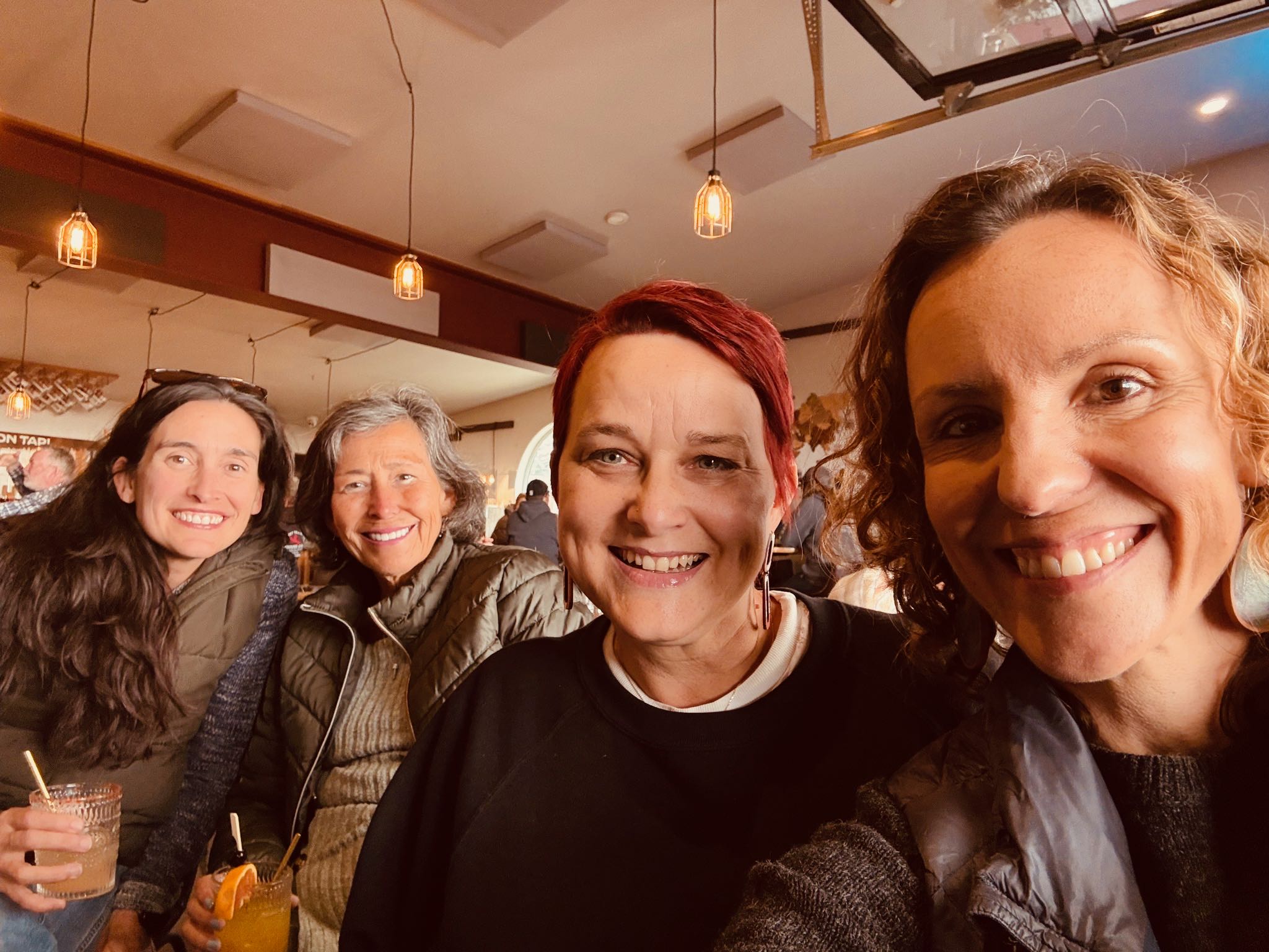 a group of women smiling for a selfie