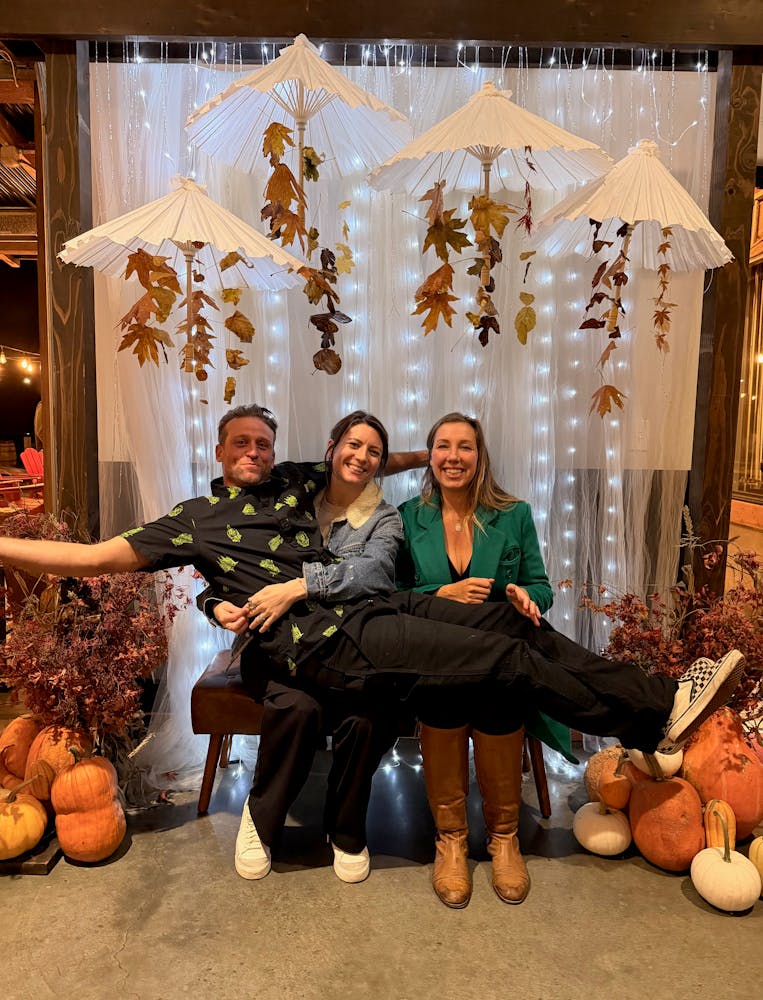 a group of people sitting in front of a building