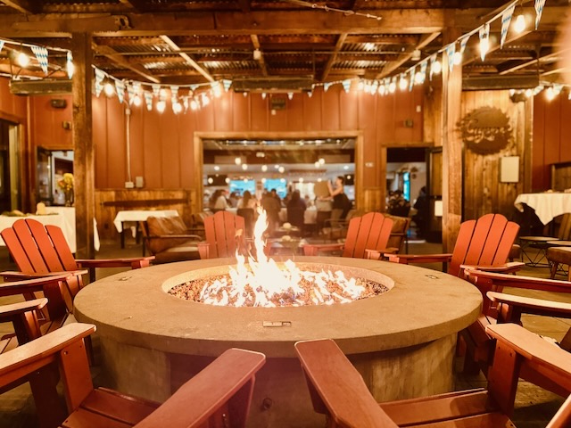 a fire pit with chairs around it