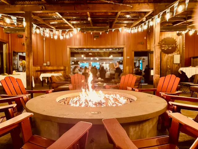 a fire pit with chairs around it
