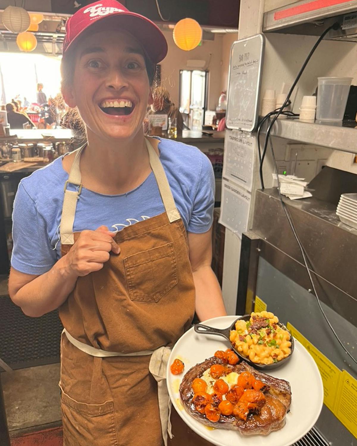 a woman holding a plate of food