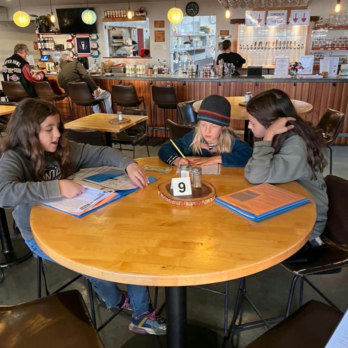 a group of people sitting at a table
