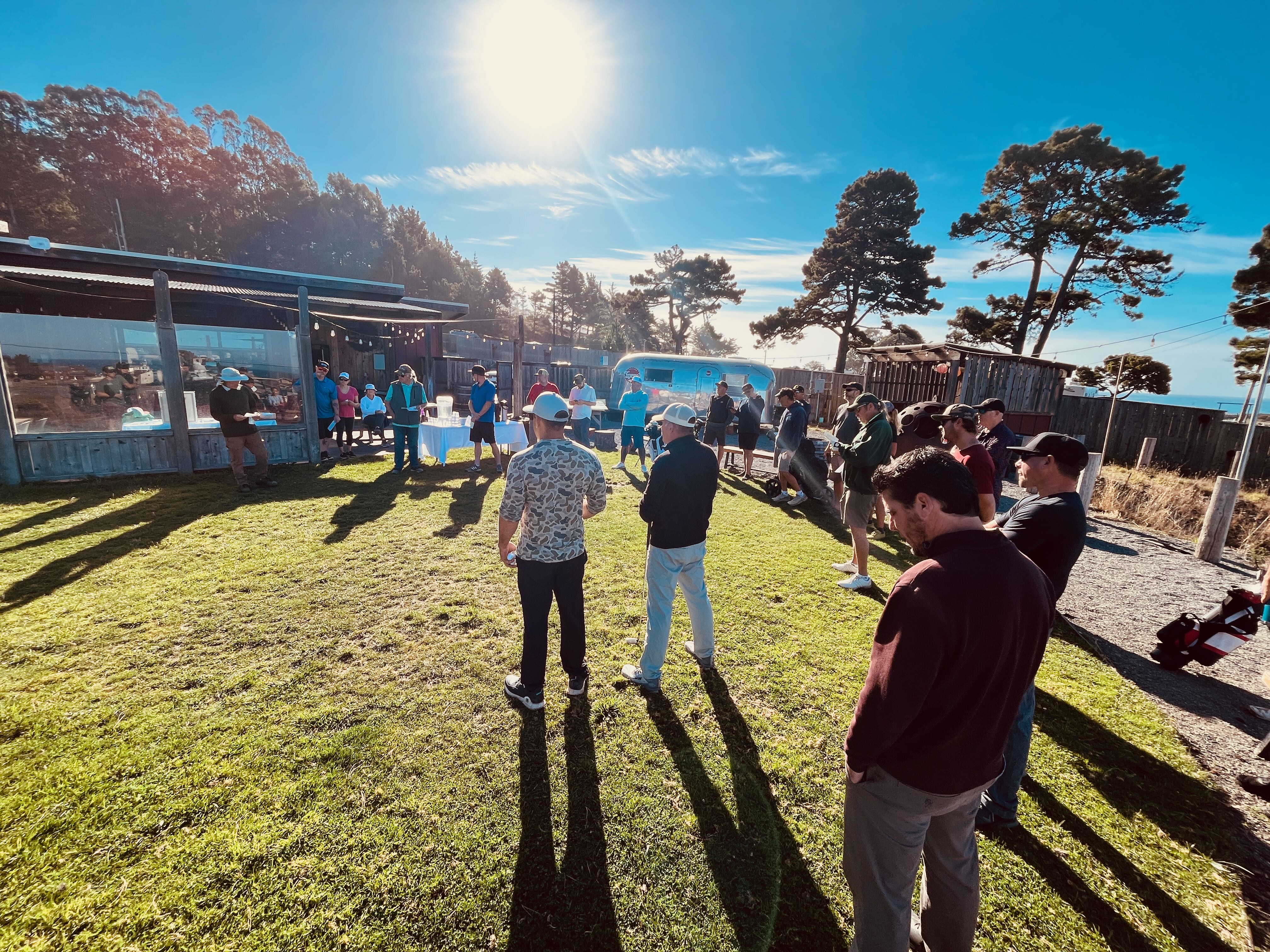 a group of people standing in a yard