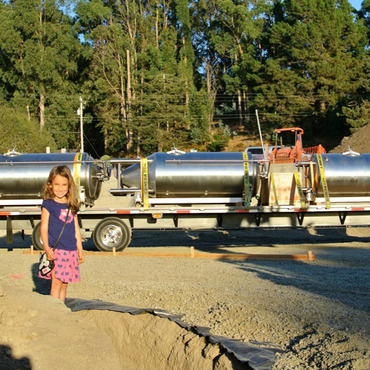 a group of people riding on the back of a truck