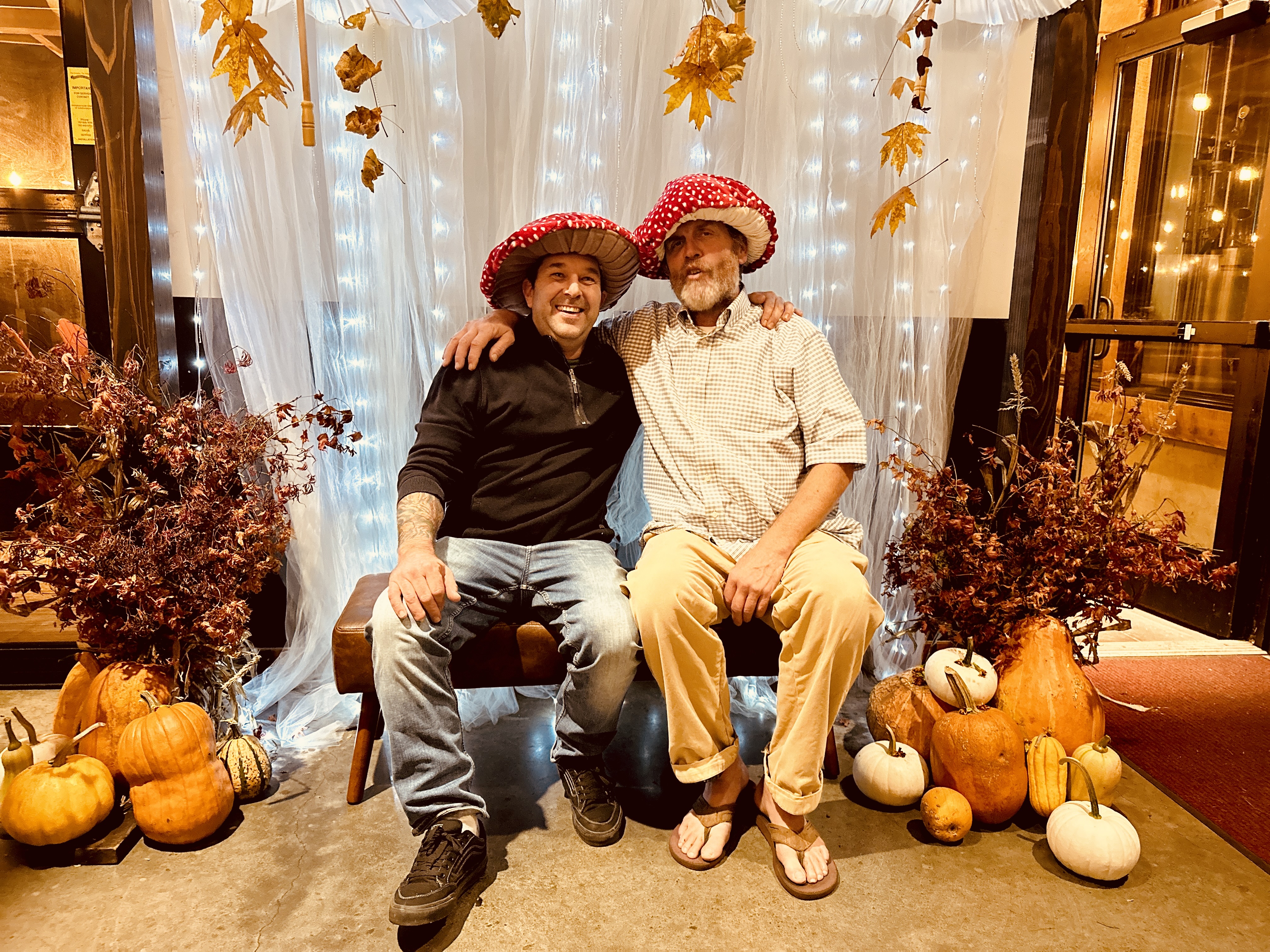 a man sitting on a bench in front of a building
