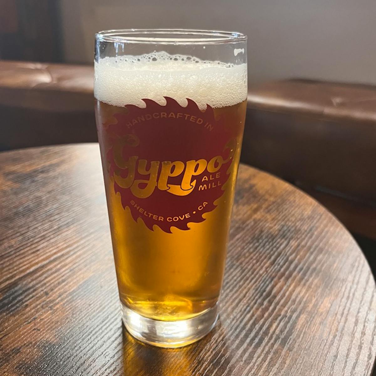 a glass of beer on a table