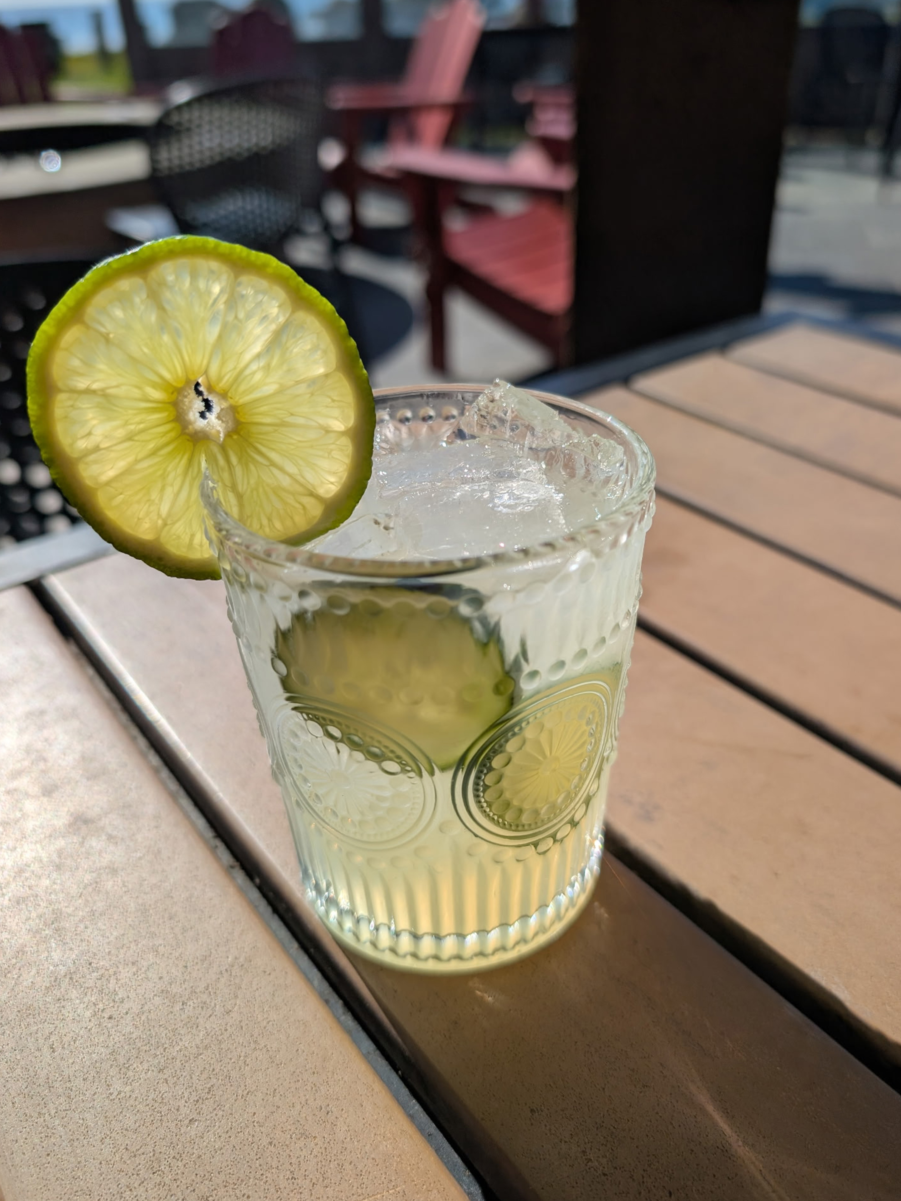 a glass with a lime slice on it