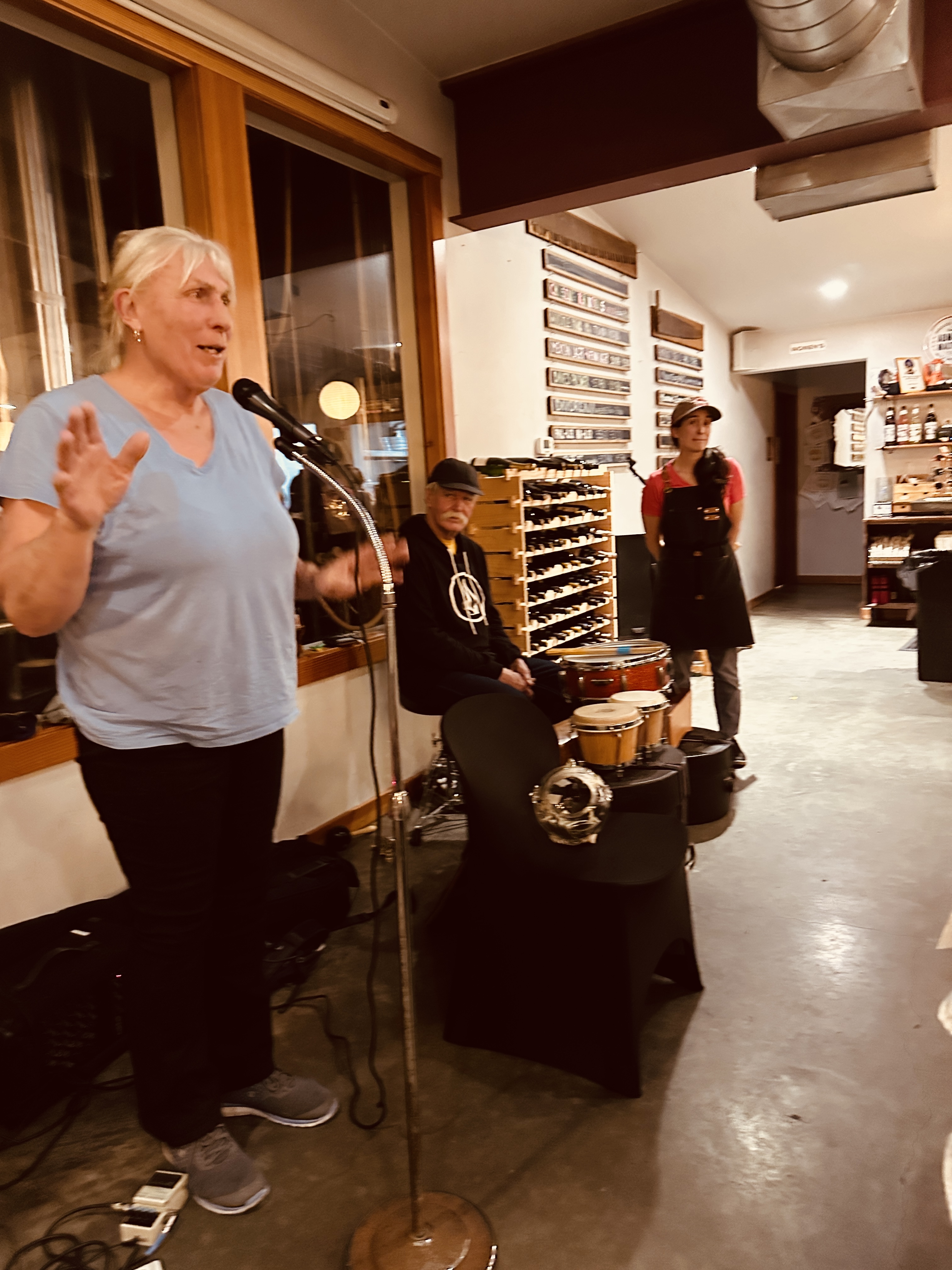 a woman standing in front of a microphone