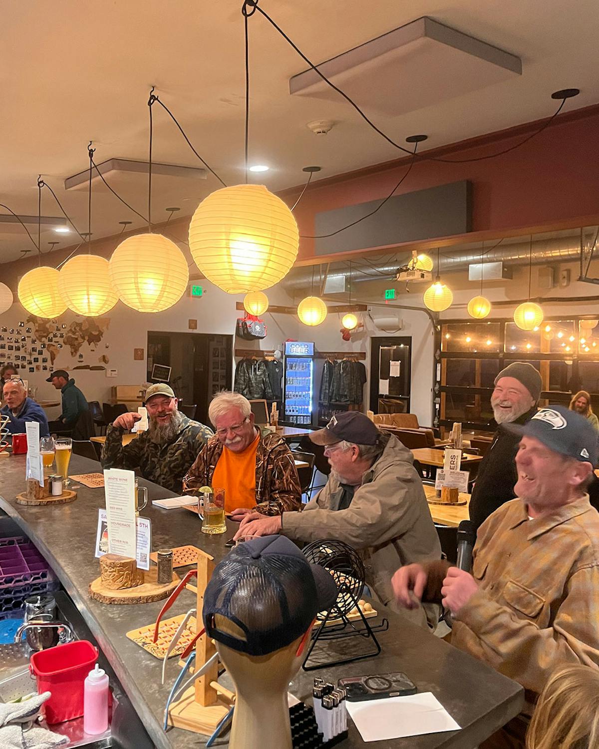a group of people standing around a table