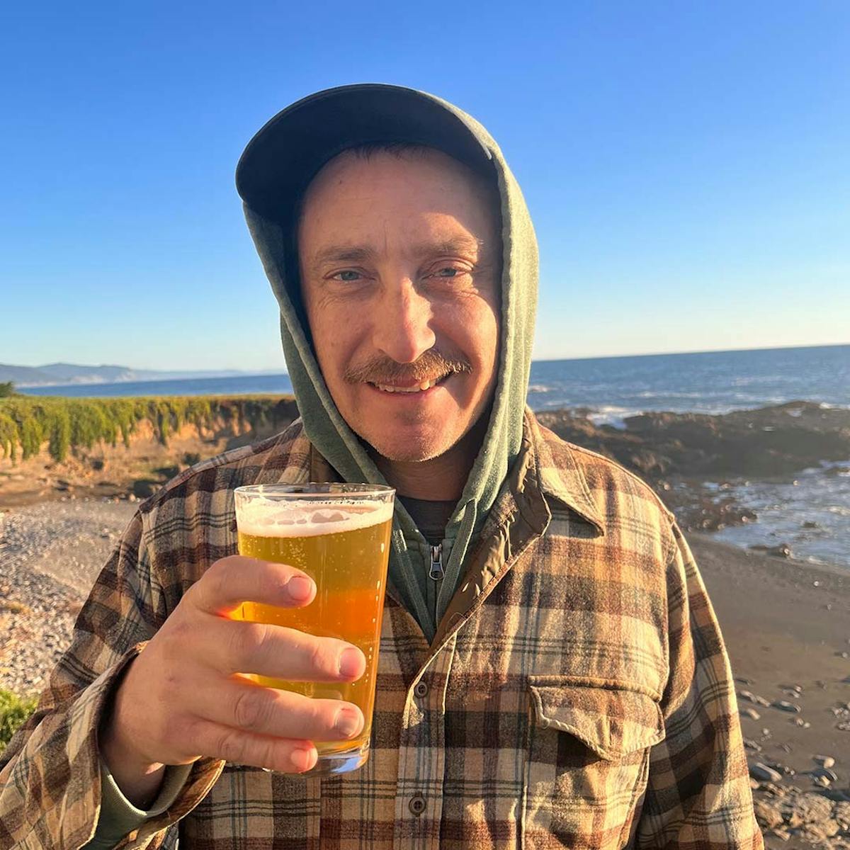 a man drinking a glass of water