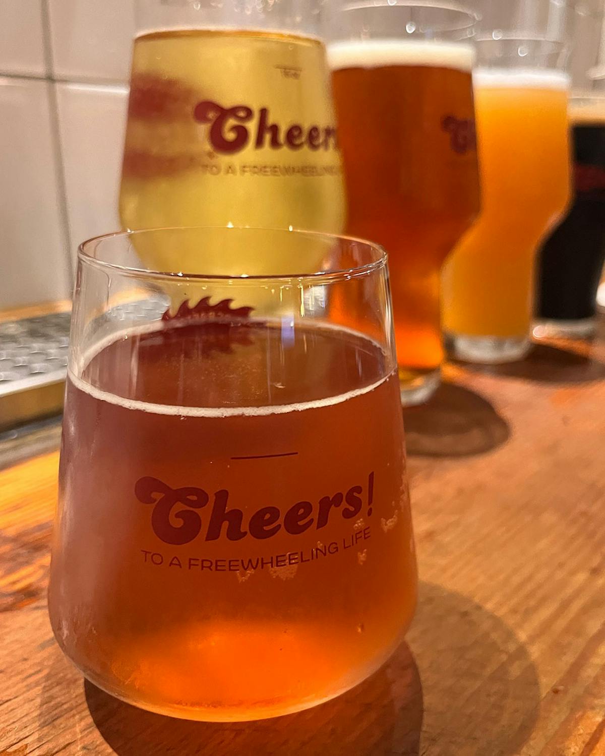 a close up of a glass of beer on a table
