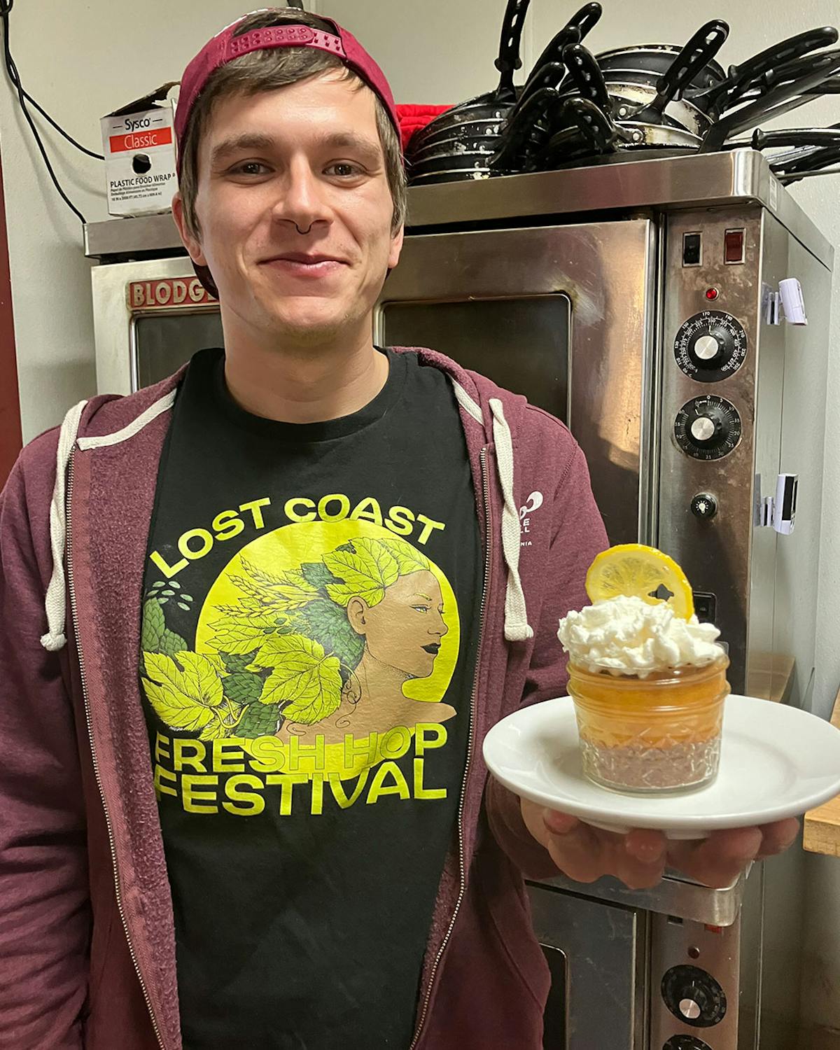 a man standing in front of a cake