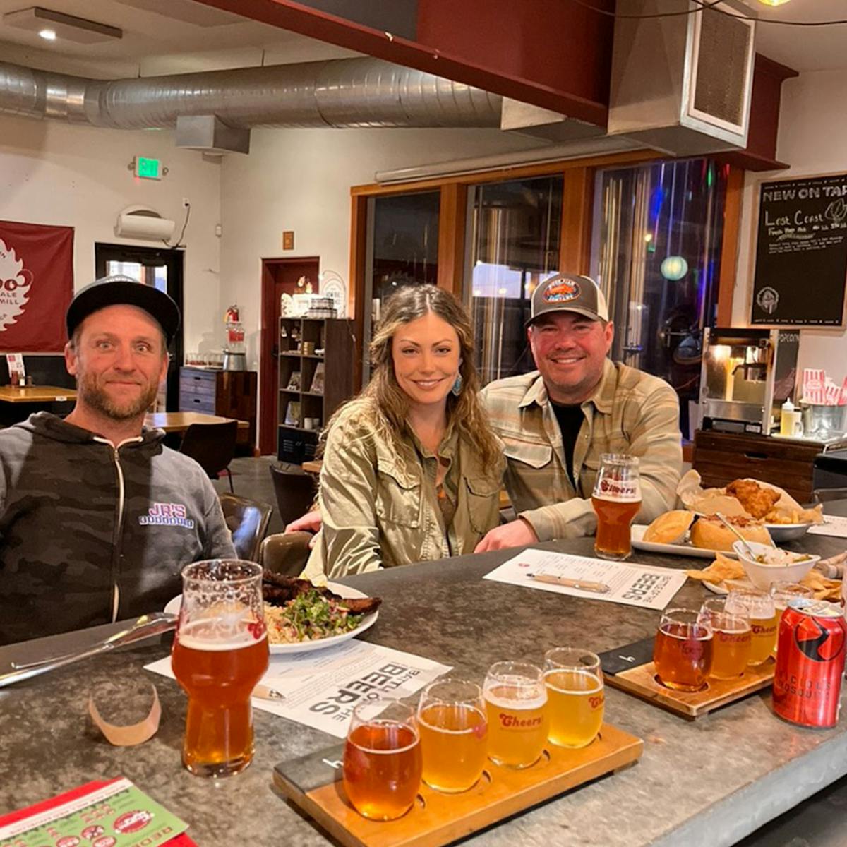 a group of people sitting at a table in a restaurant
