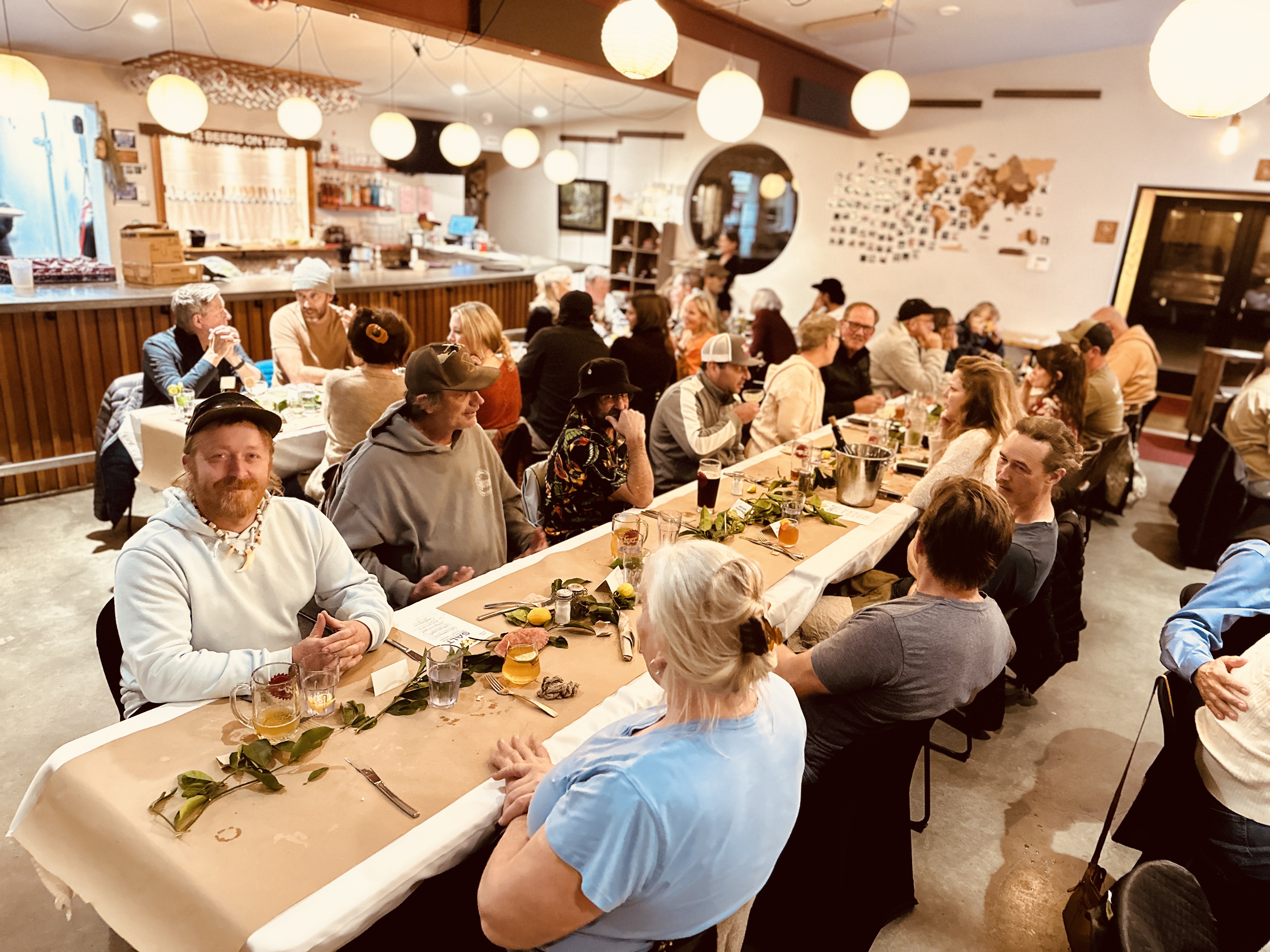 a group of people sitting at long tables