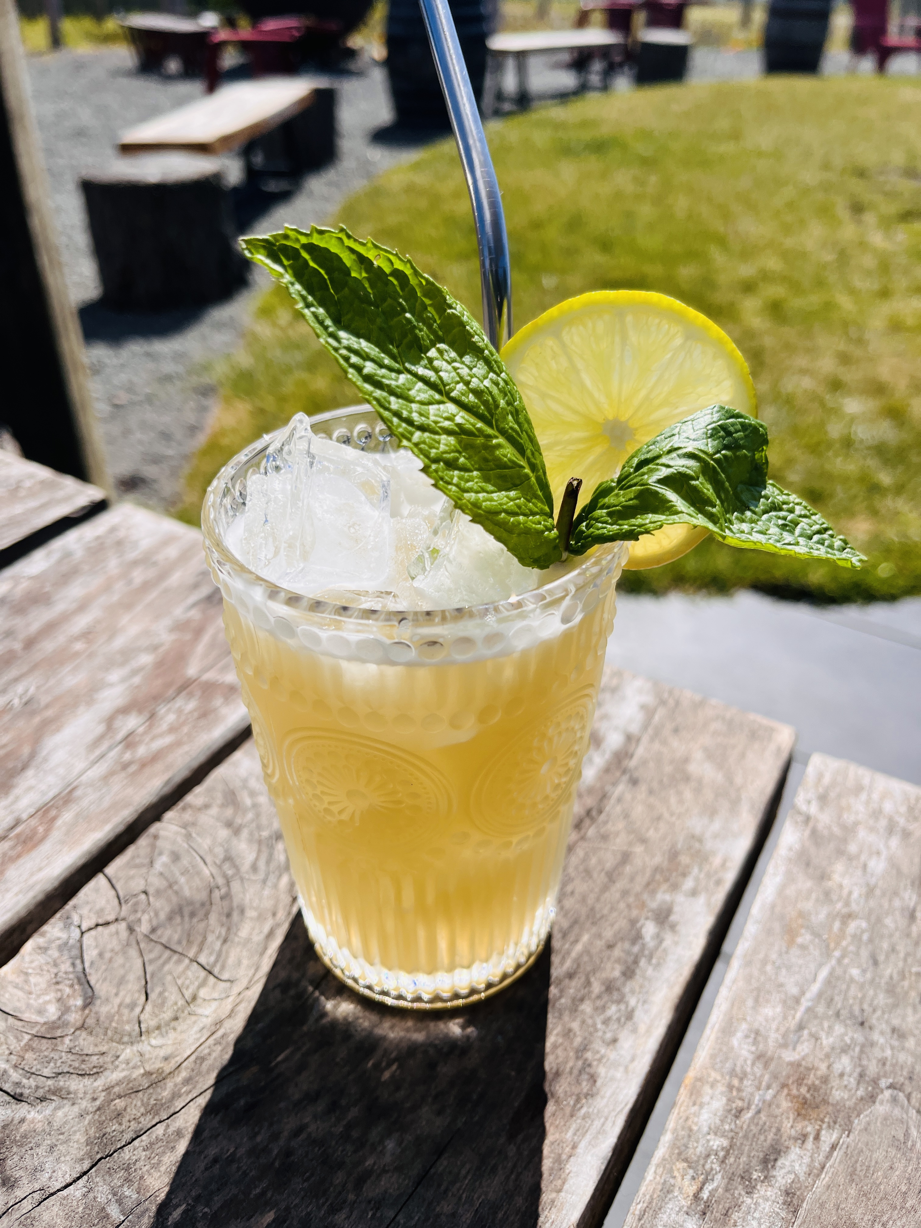 a glass cup on a wooden table