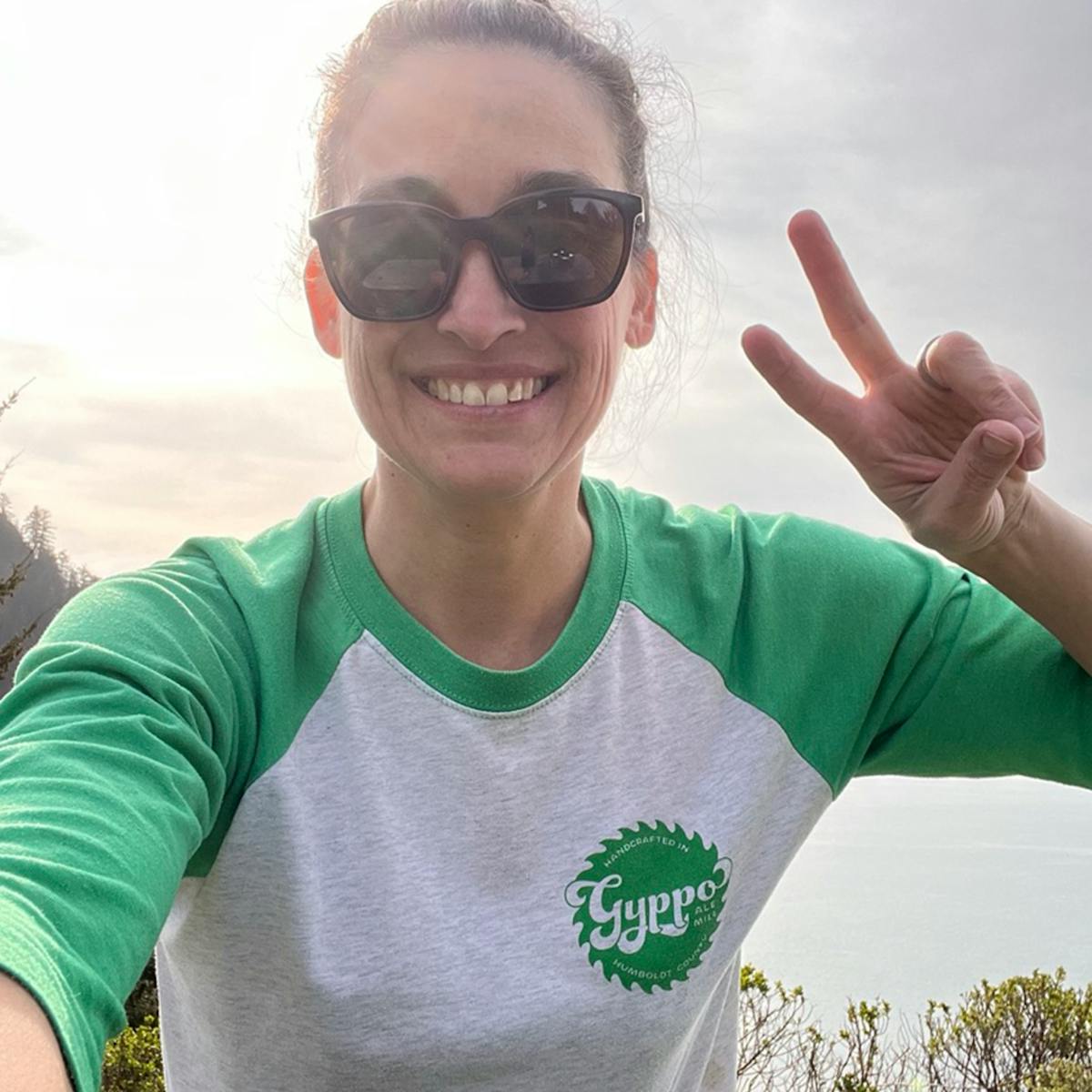 a person wearing sunglasses taking a selfie