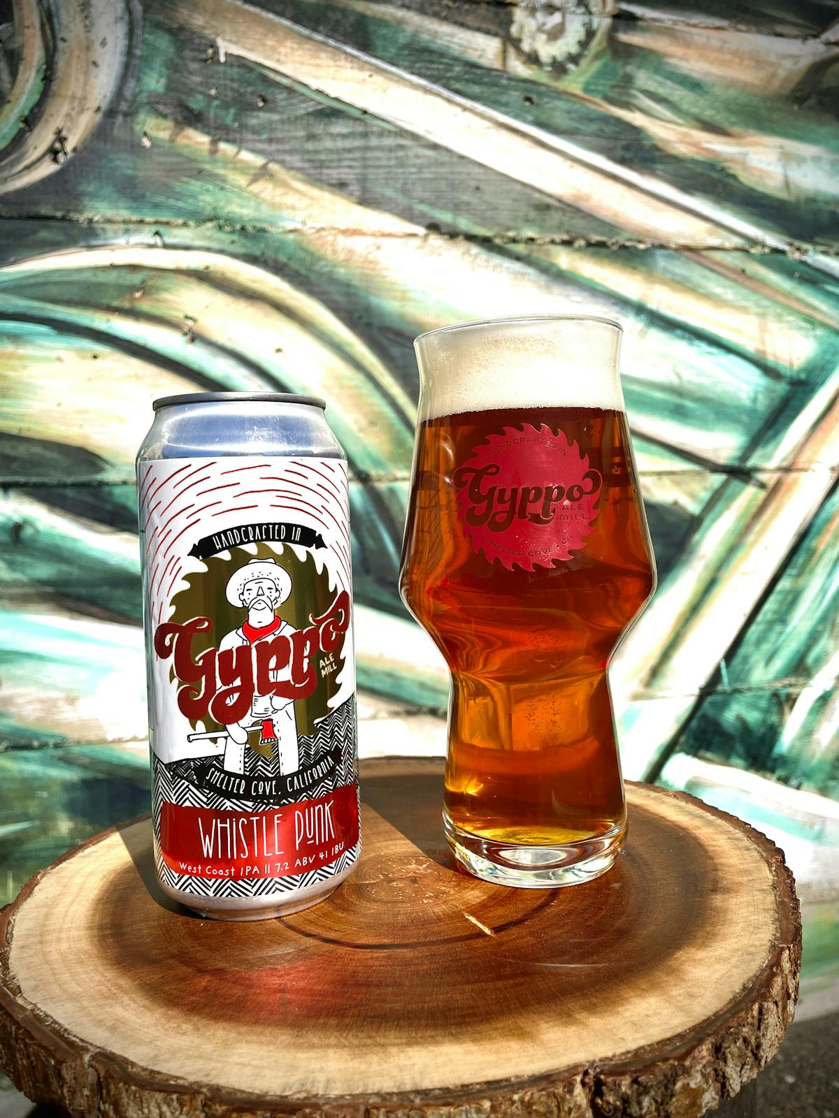 a bottle and a glass of beer on a table