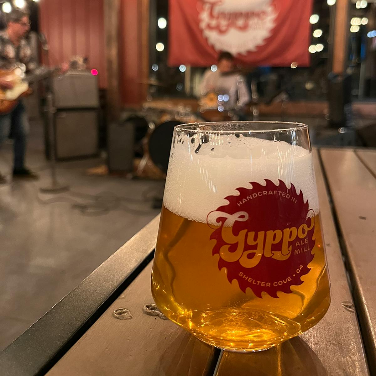 a glass of beer on a table