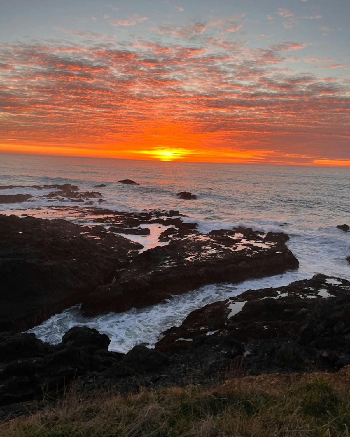 a sunset over a body of water