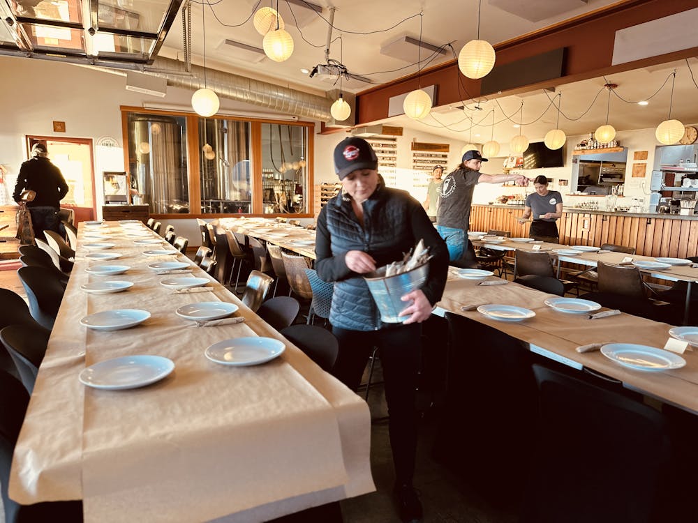 a group of people sitting at a table in a restaurant