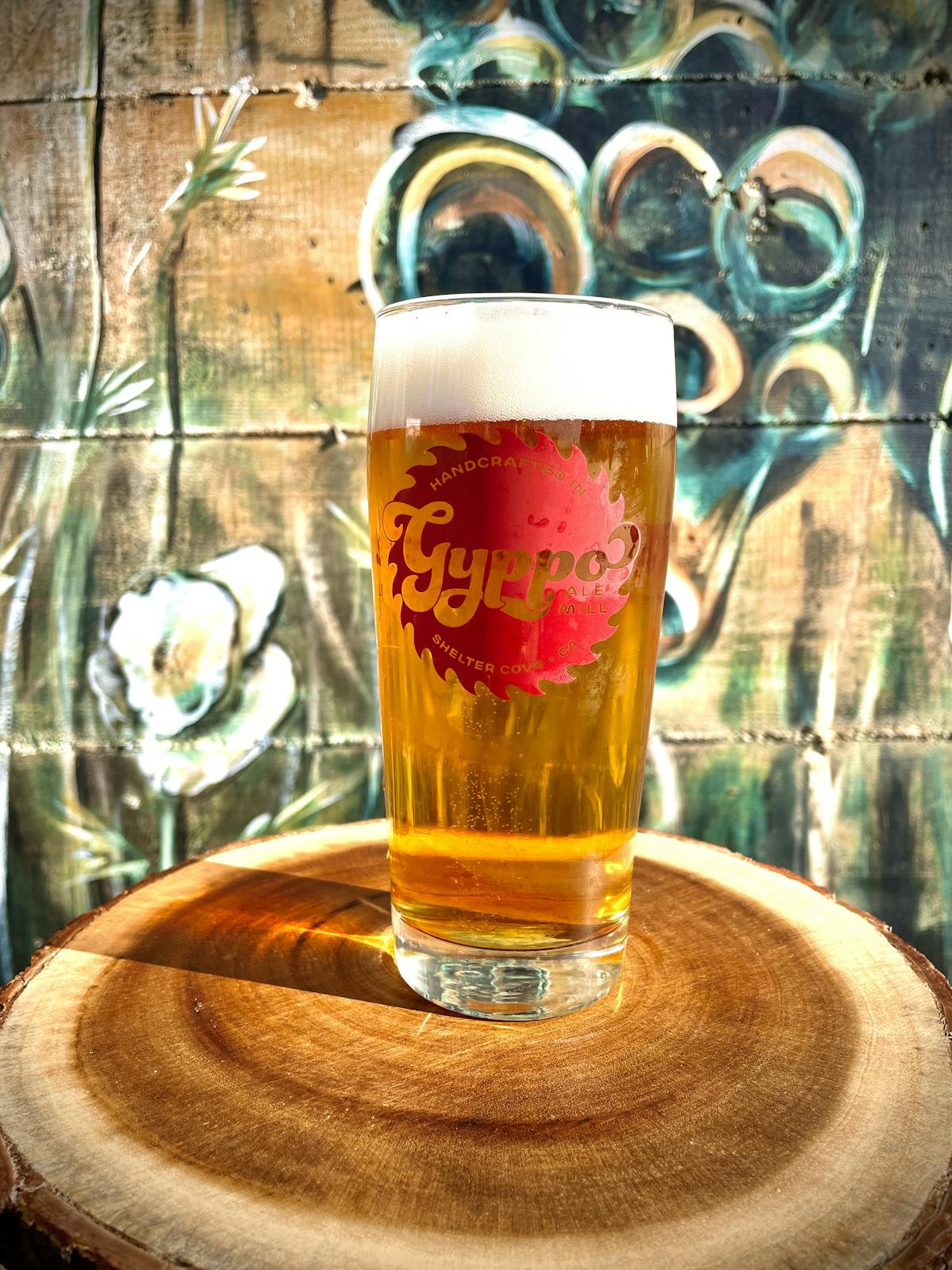 a cup of coffee and a glass of beer on a table