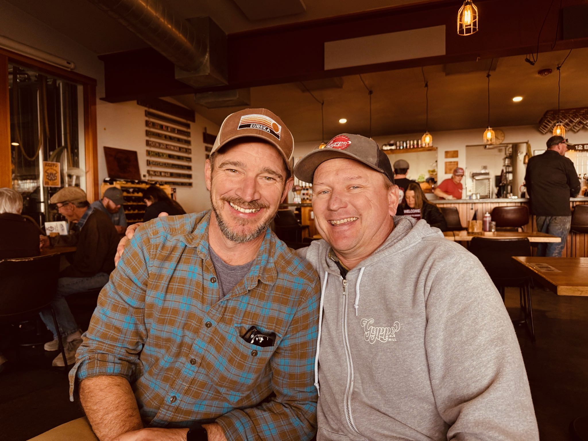 two men sitting at a table