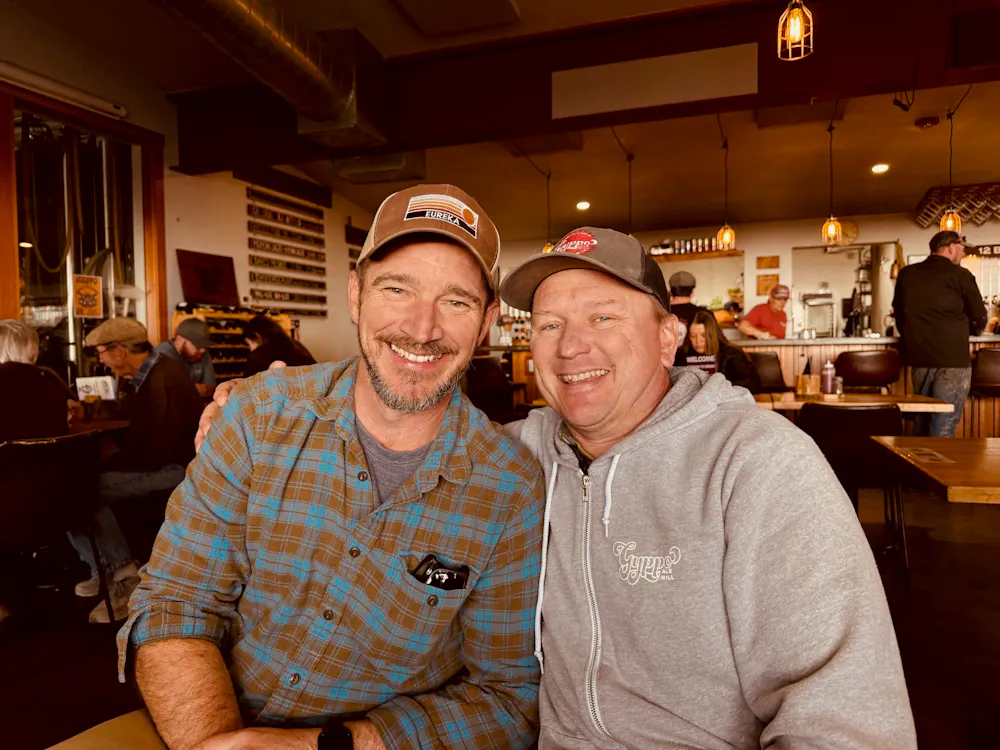 two men sitting at a table