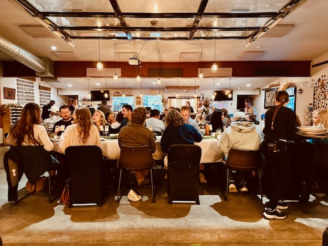 a group of people sitting at tables