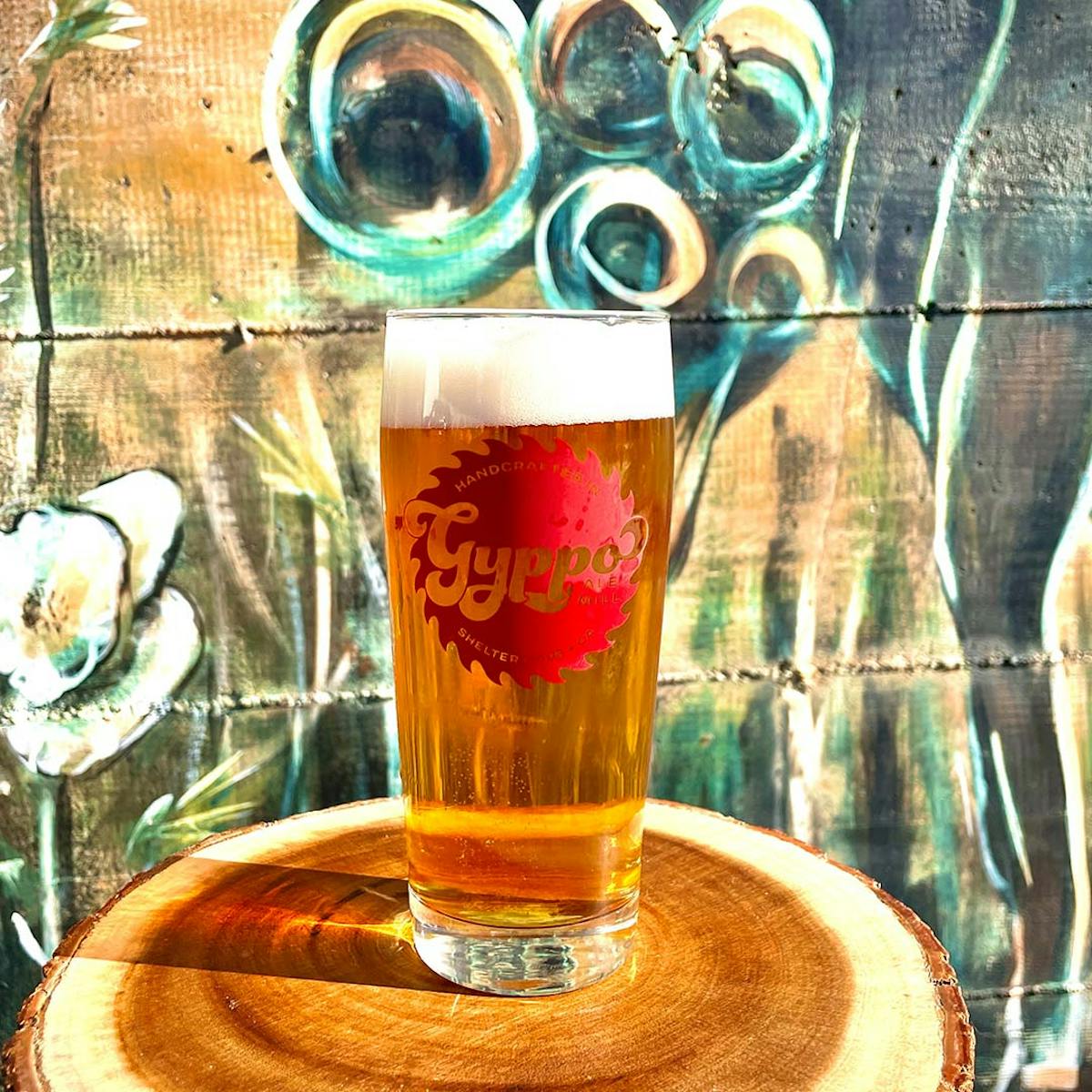 a glass of beer on a table