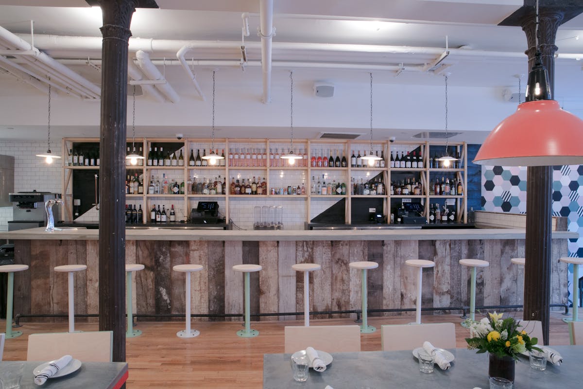 a room filled with furniture and vase on a table