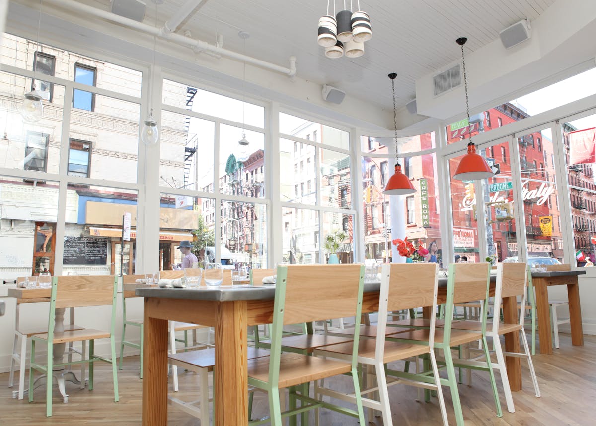 a dining room table in front of a building