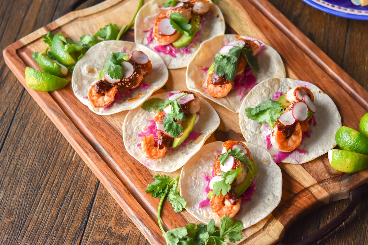 a bunch of food sitting on top of a wooden table
