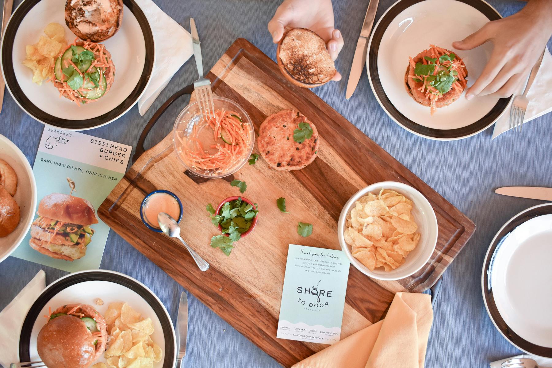 a bunch of food sitting on top of a wooden table