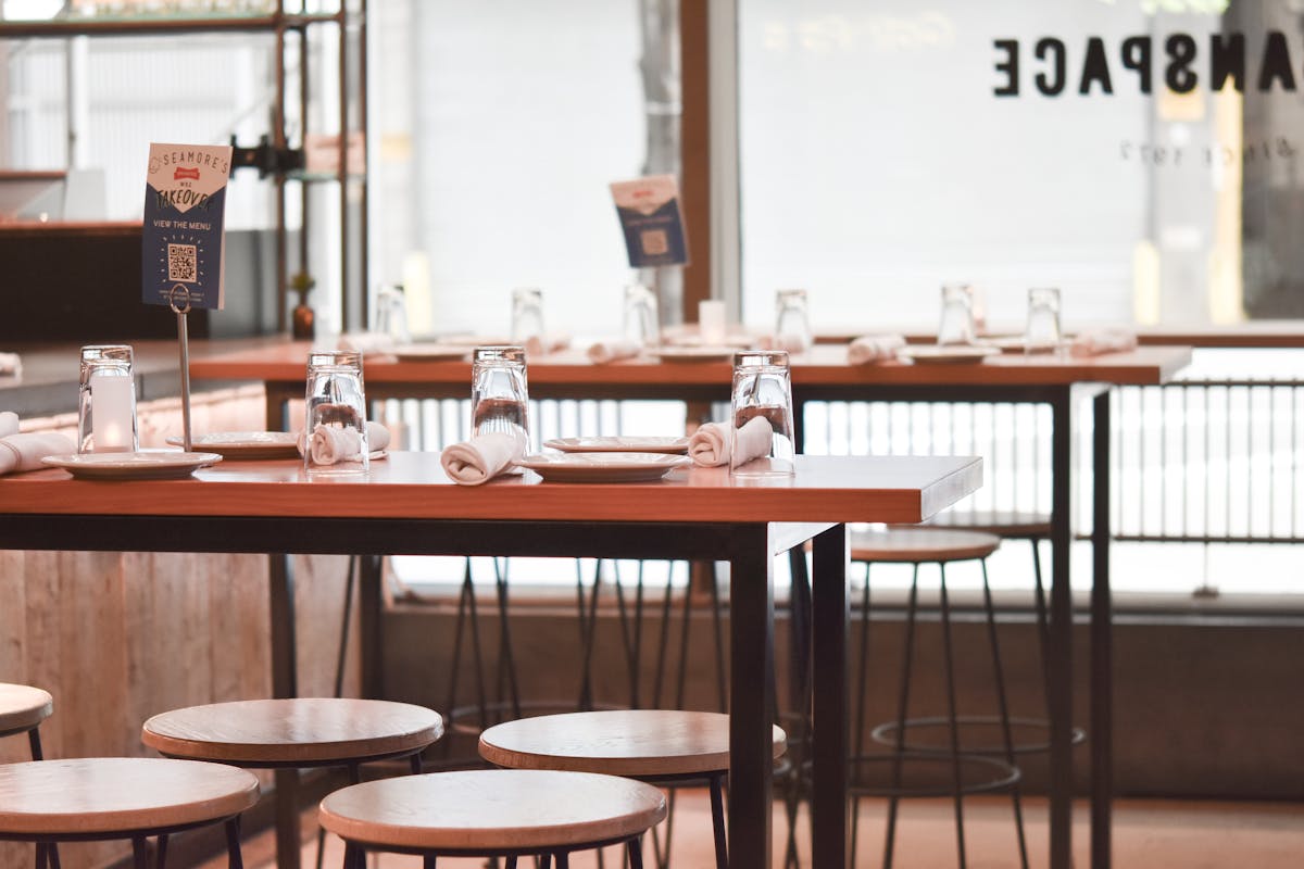 a dining room table in front of a window